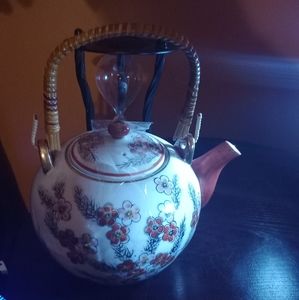 This is a beautiful vintage q JAPANESE PORCELAIN GEISHA GIRL BAMBOO HANDLE TEAPO